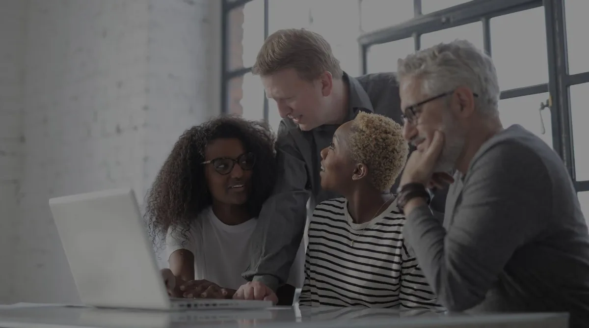 Team in discussion around a table