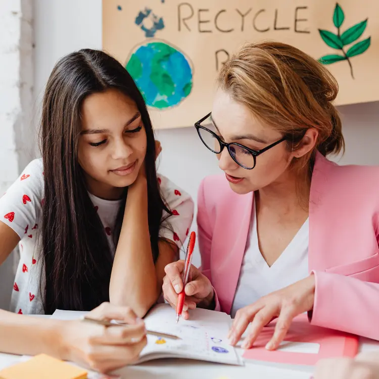 Teaching assistant supporting pupils
